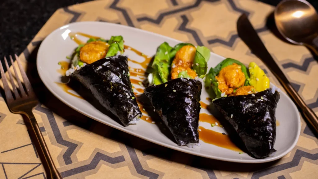 Temaki sushi hand roll with rice and seaweed
